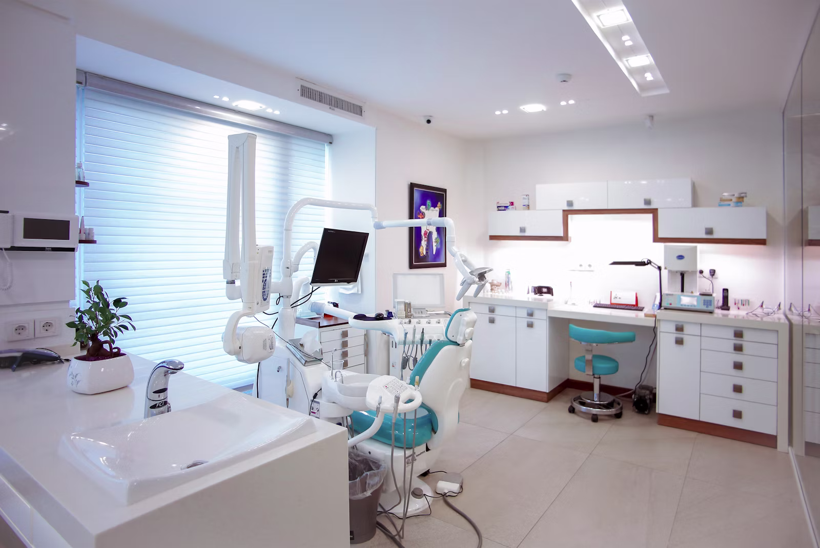 A clear removable orthodontic aligner tray held between two fingers